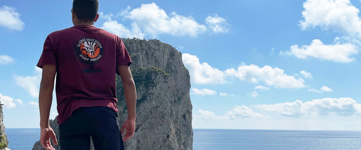 A Hampden-Sydney College student looking out over the atlantic ocean