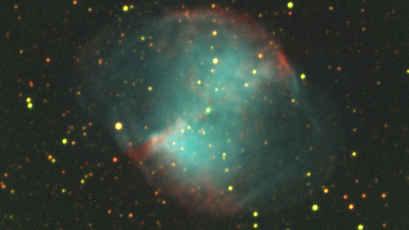 This is an image of the Dumbbell Nebula, a planetary nebula. It was observed with the R filter (red), the G filter (green), and the H-α filter (blue). The H-α images took the longest to exposure, with an integration time of 1000 seconds, or 16 minutes and 40 seconds.