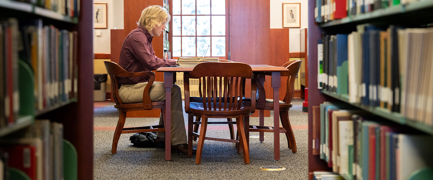 a student doing research in the library