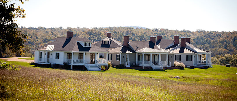 a cluster of modern cottage homes in an open field