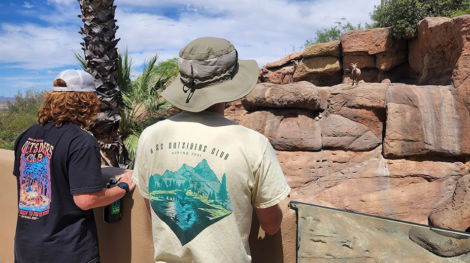 students admiring the stone formations in the Mexican Gila Wilderness 