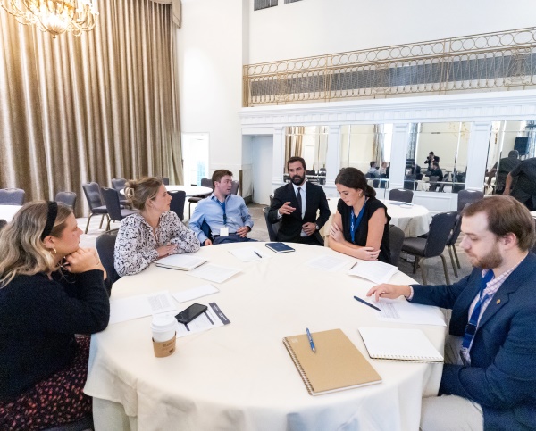 William Gardner &rsquo;25 and Devan Modak &rsquo;26 sitting at a conference table