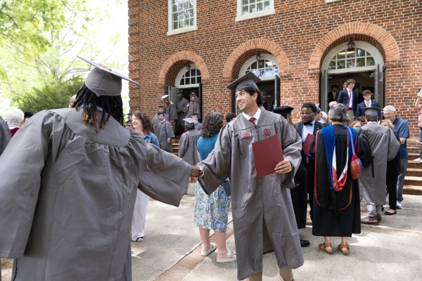 class of 2025 shaking hands outside the auditorium