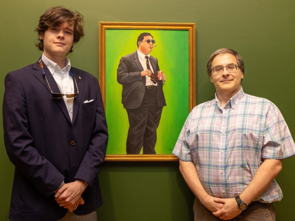 a portrait painting of John Brinkley in his typical stance with students and professor