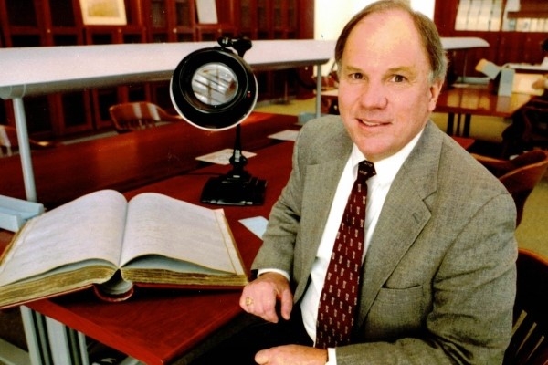 Conley Edwards ’67 sitting at his archivist desk