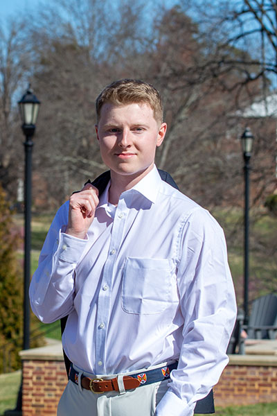 Noah Selfe '23 standing outside in front of H-SC Bell Tower