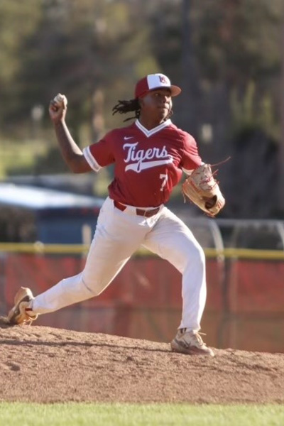 Alex Fist-Hugh pitching a baseball on the mound