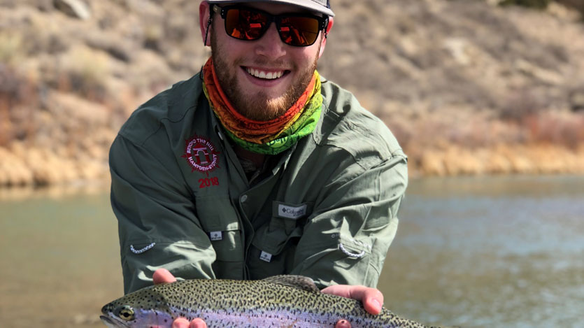 student showing a trout