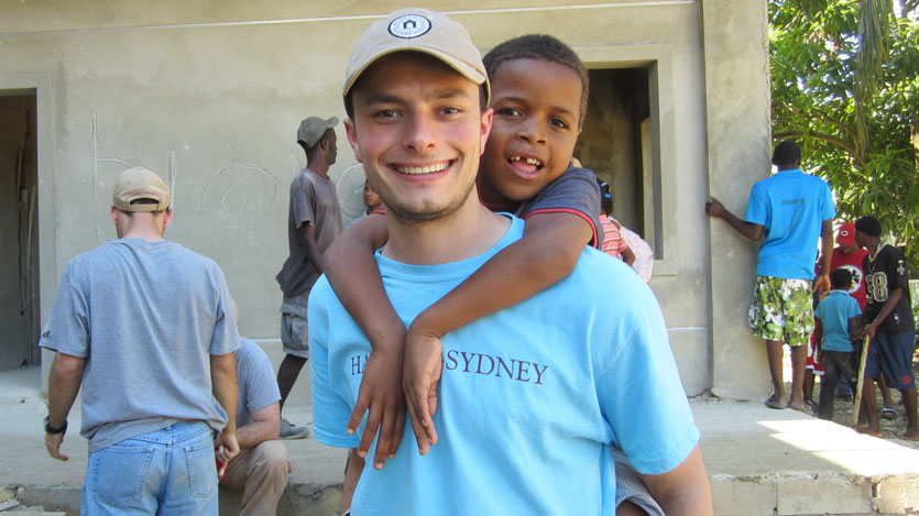 a student holding a child on his back