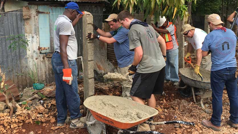 student working on a school in Dominican Republic